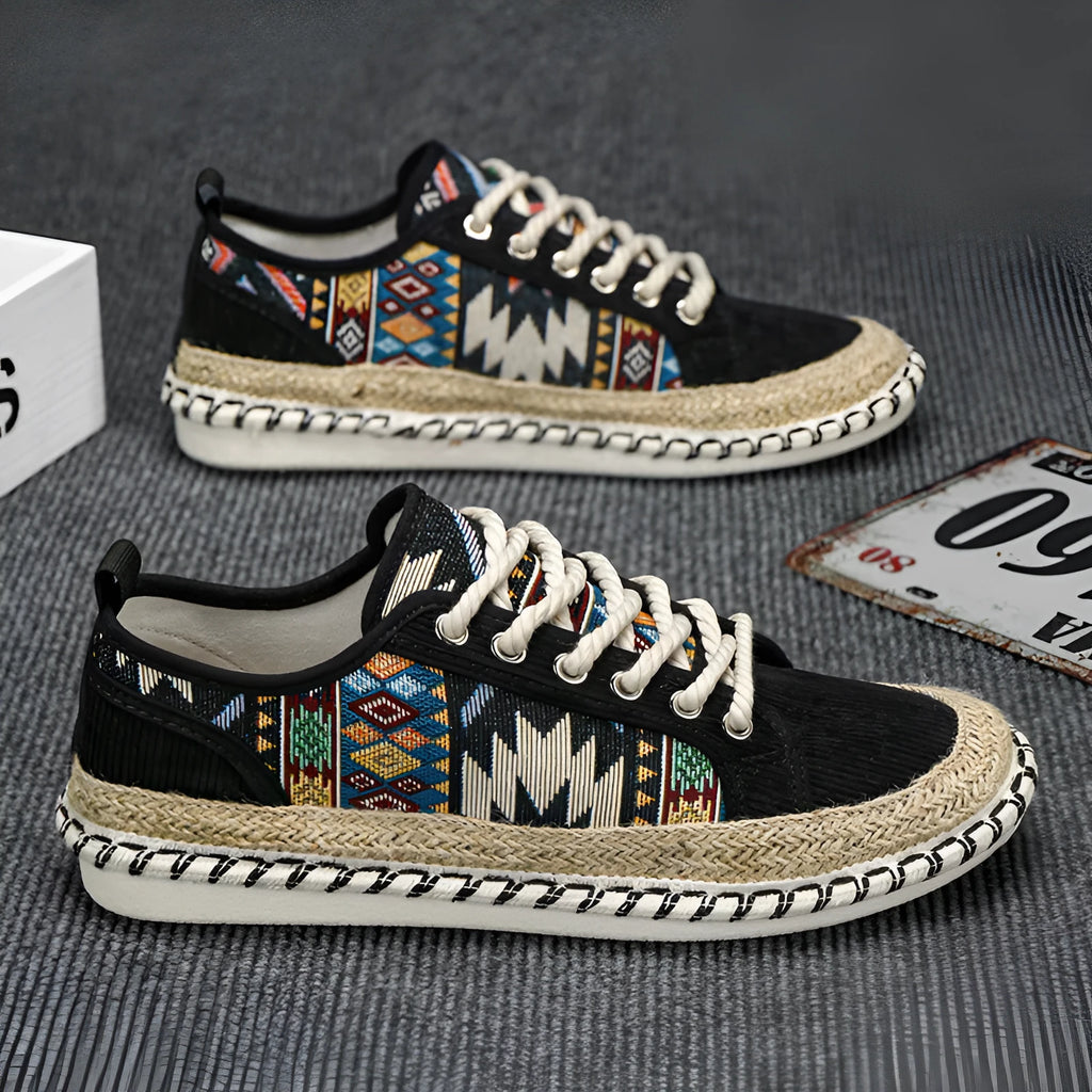 Men's beige and black cloth casual shoes with round toe, shown from the side.