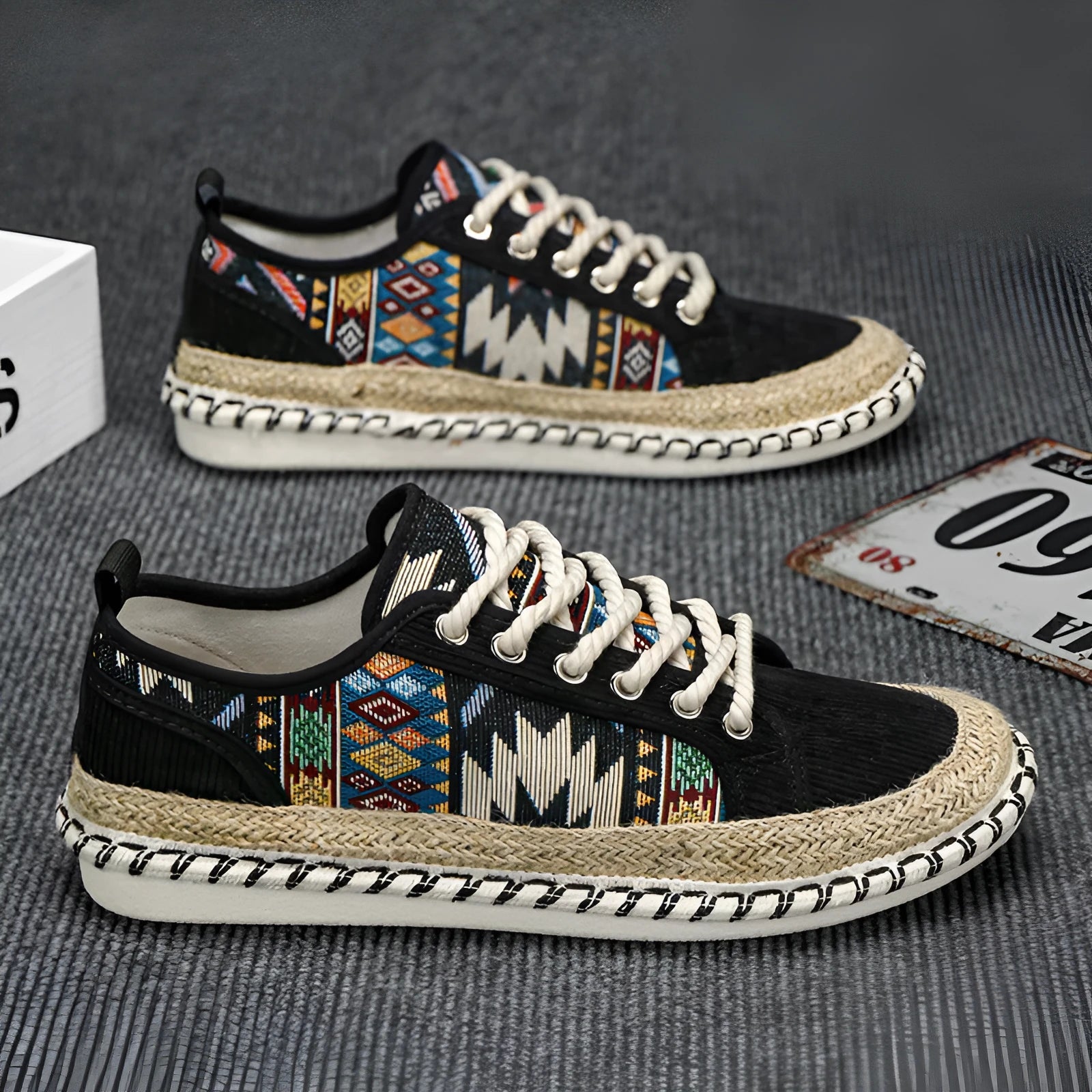 Men's beige and black cloth casual shoes with round toe, shown from the side.