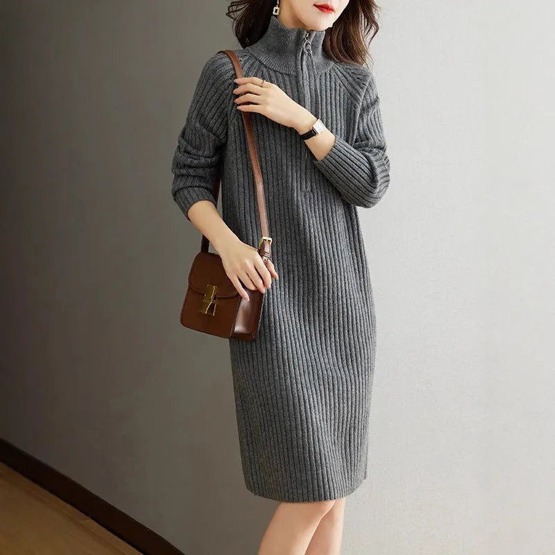 Beige woolen skirt with half zipper front, stand collar and loose long sleeves in straight dress silhouette