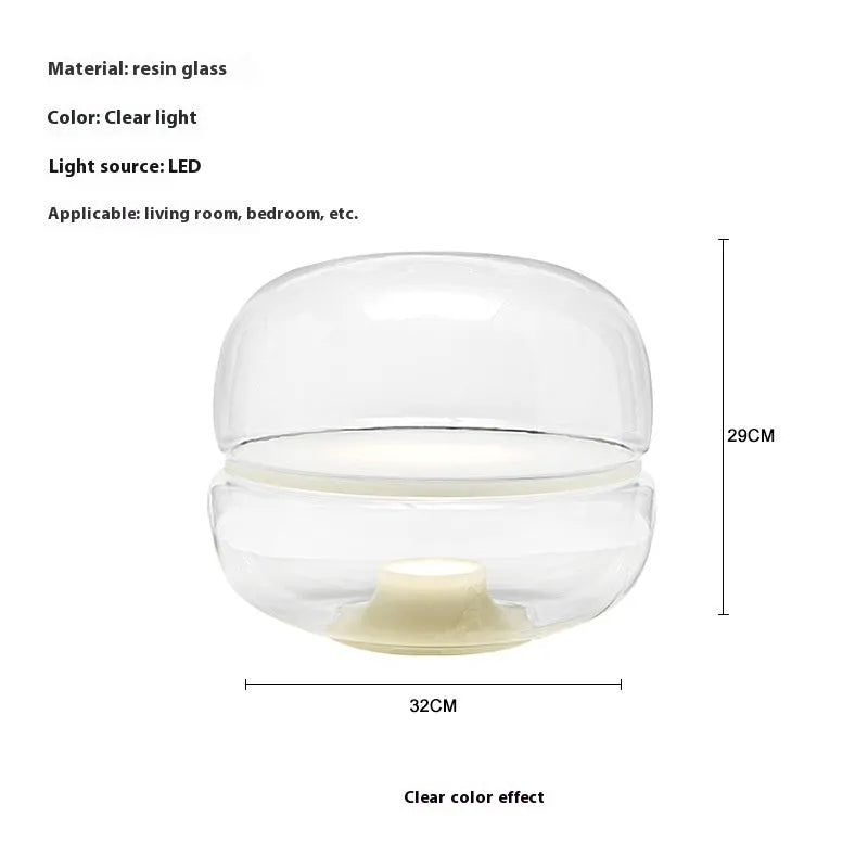 Nordic modern creative table lamp with warm light on a desk