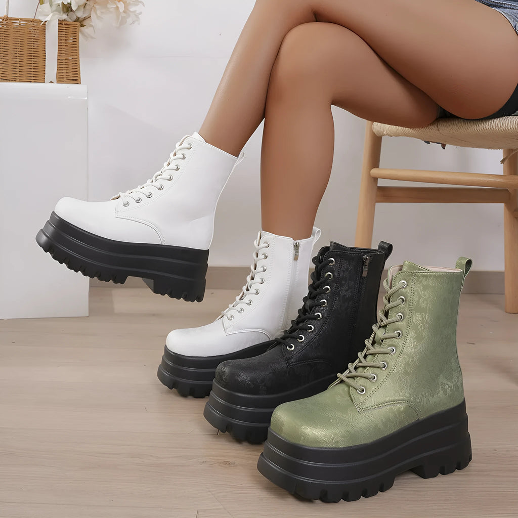 Women's black retro platform Martin boots with chunky heel and side zipper detail.