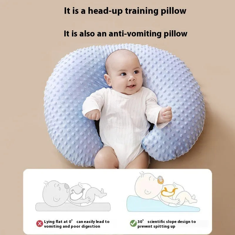 Grey multifunctional nursing pillow with milk spill prevention design on a neutral background