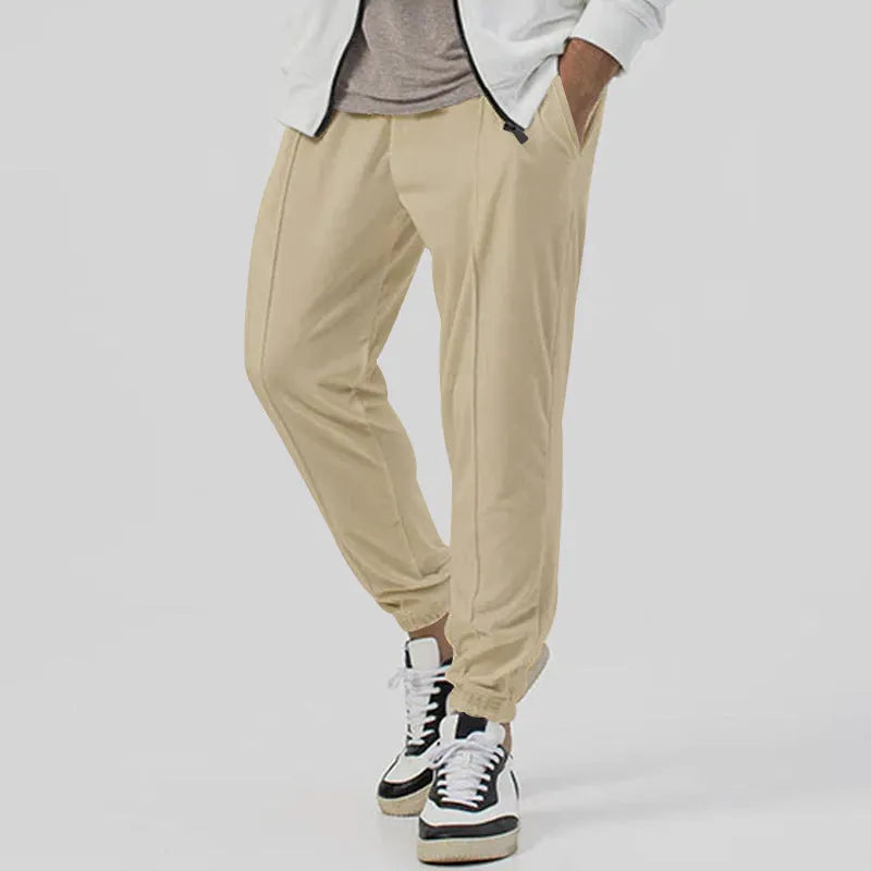 Men's grey casual tapered sweatpants with an elasticated waistband and straight-leg design