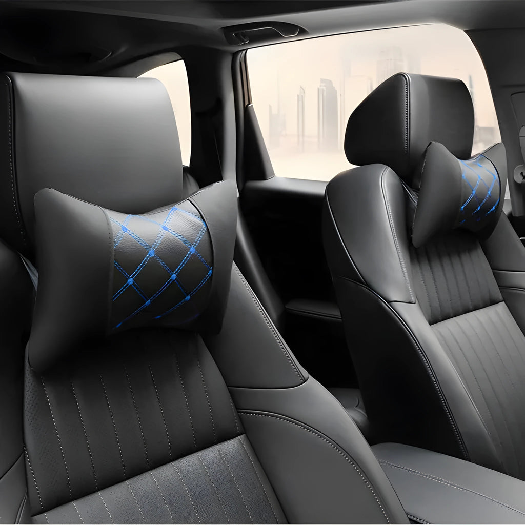 Black quilted leather car headrest pillow with diamond pattern and red stitching for neck support.