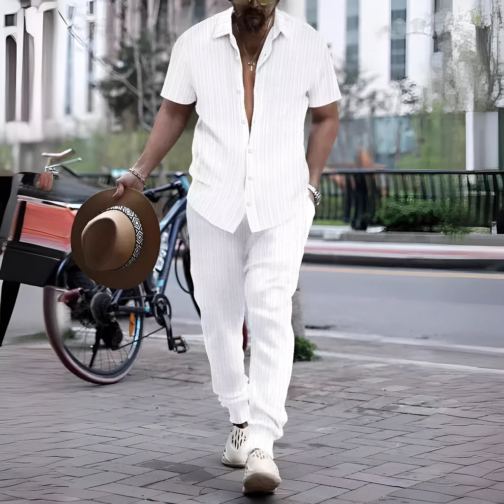 Men's loose-fit casual shirt and trousers suit in a cotton blend fabric, shown in a light blue colour.