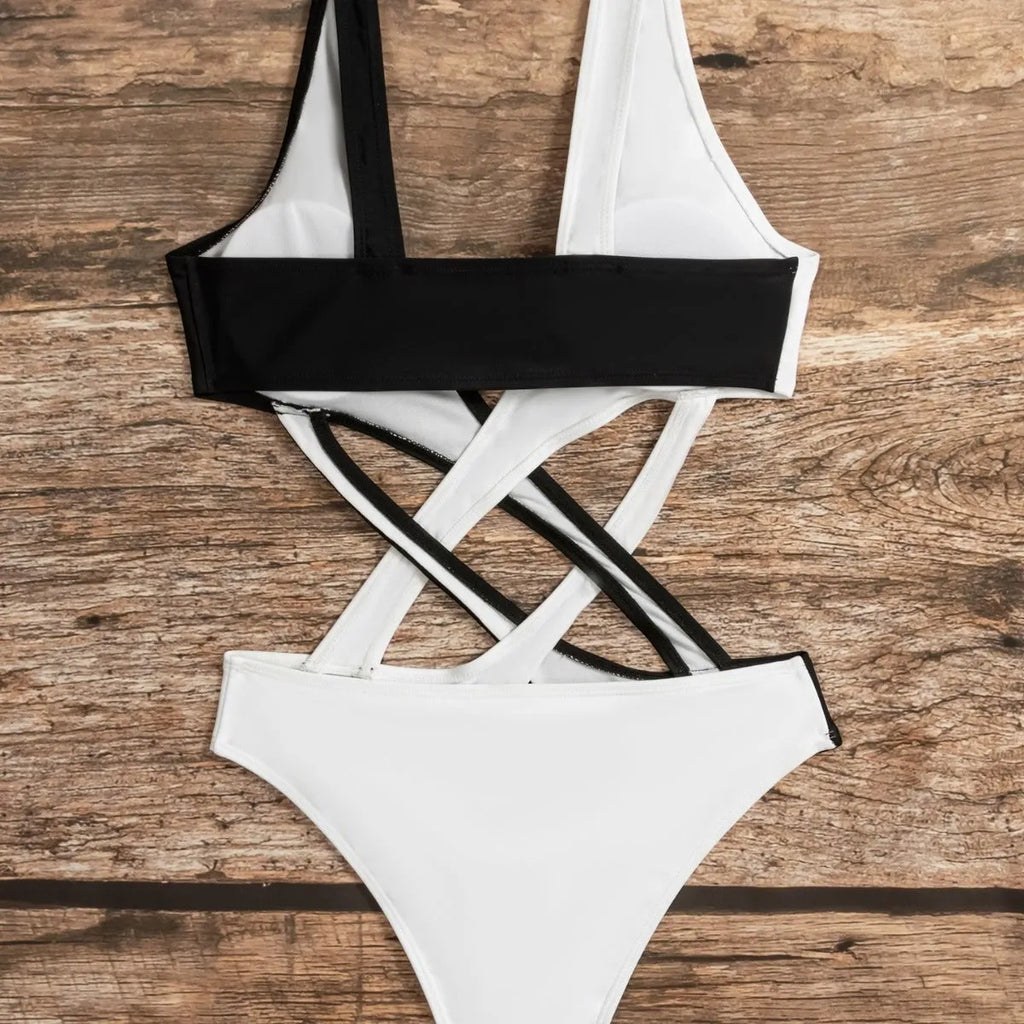 White women's one-piece swimsuit with colour-blocking and hollow-out design details.