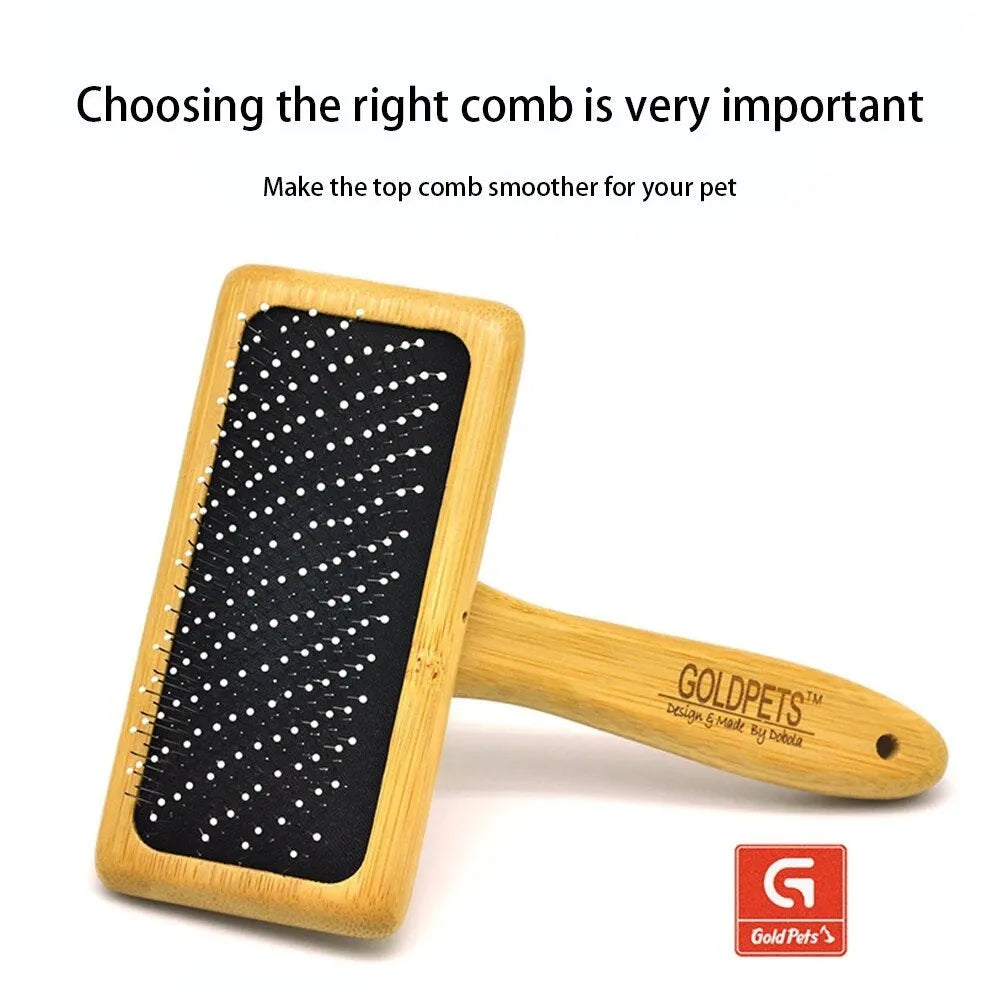 Goldpets bamboo and wood pet slicker brush with stainless steel pins on a wooden table.
