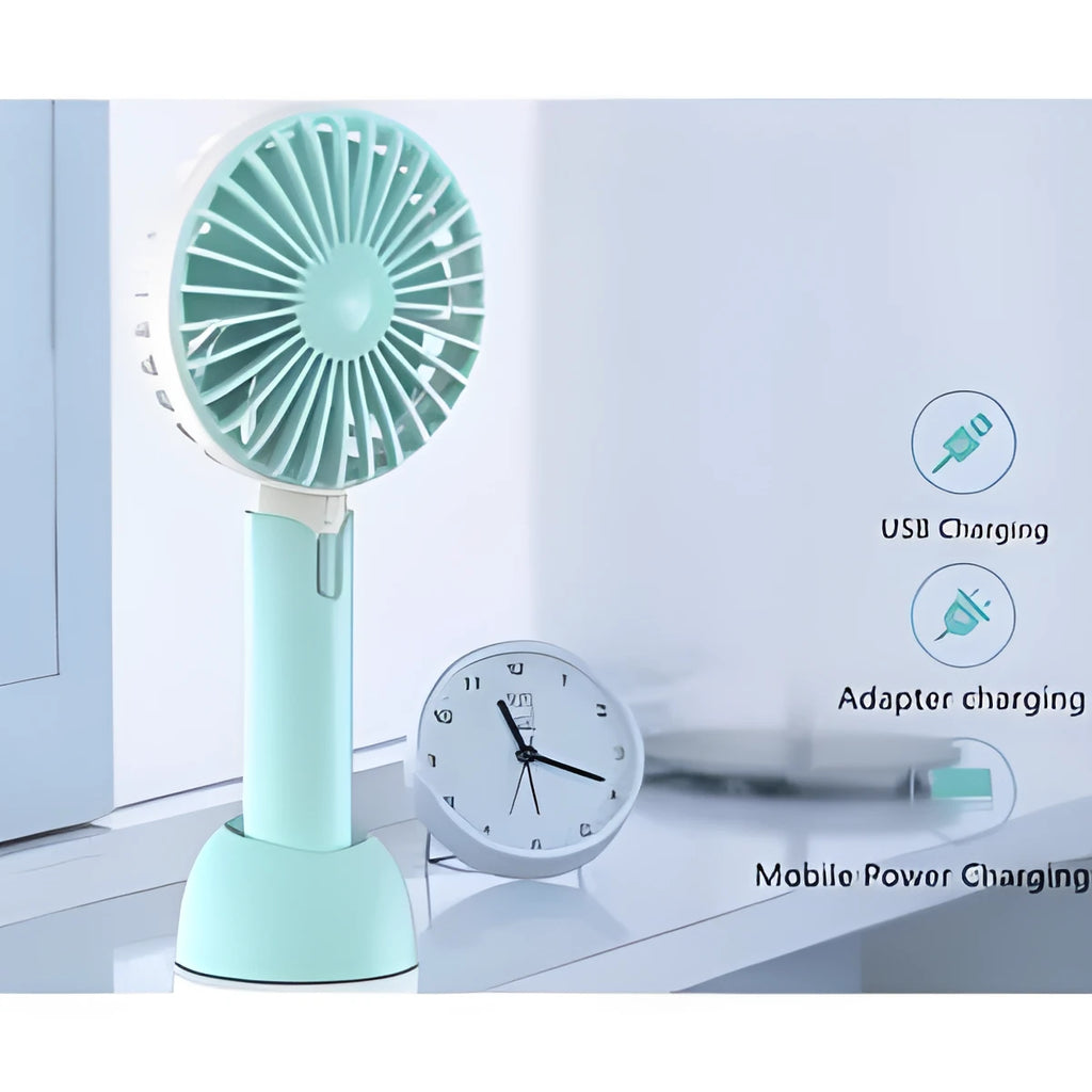 Blue handheld USB mini electric fan with three-speed control on a desk.