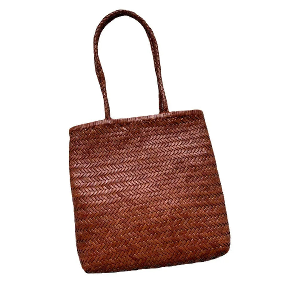 Brown woven genuine cowhide leather tote bag with a front pocket.