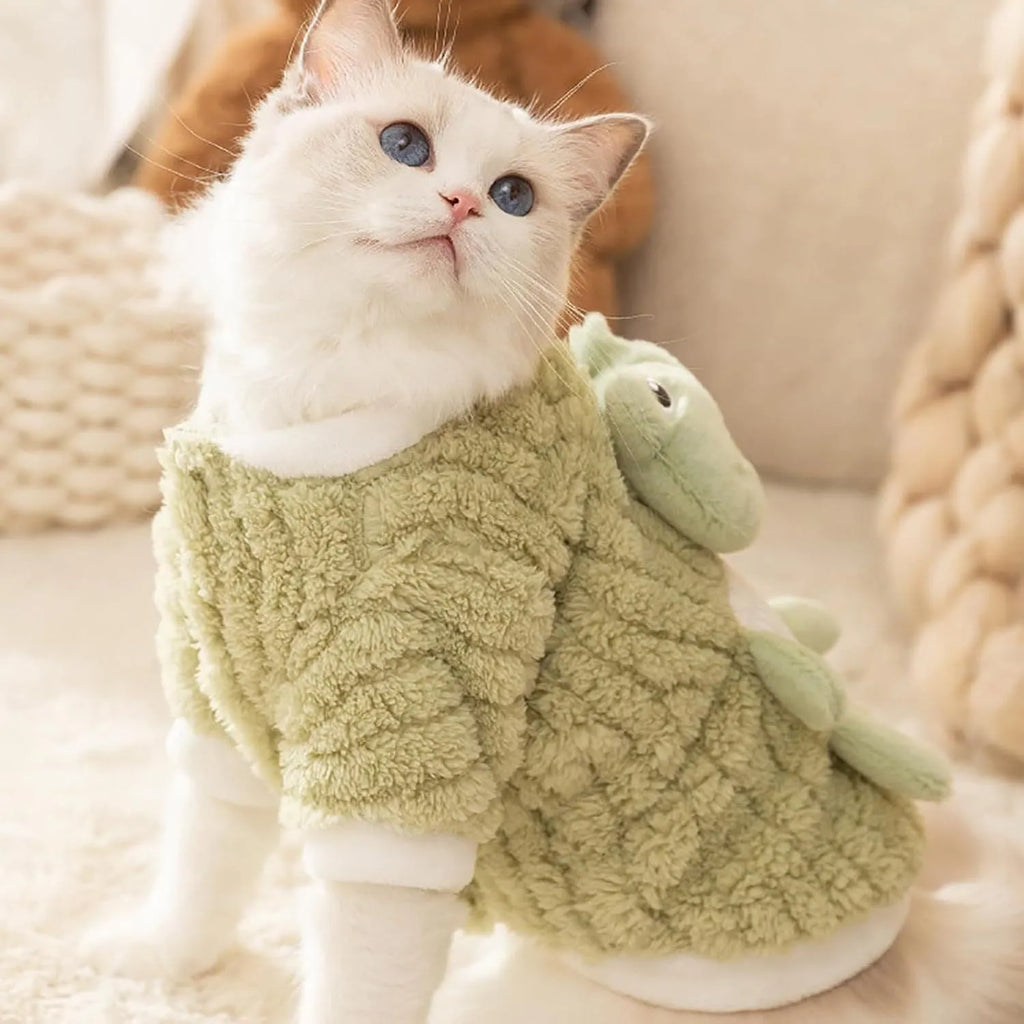 Green plush fleece dog hoodie with 3D frog face, white trim, and D-ring on belt for lead attachment.