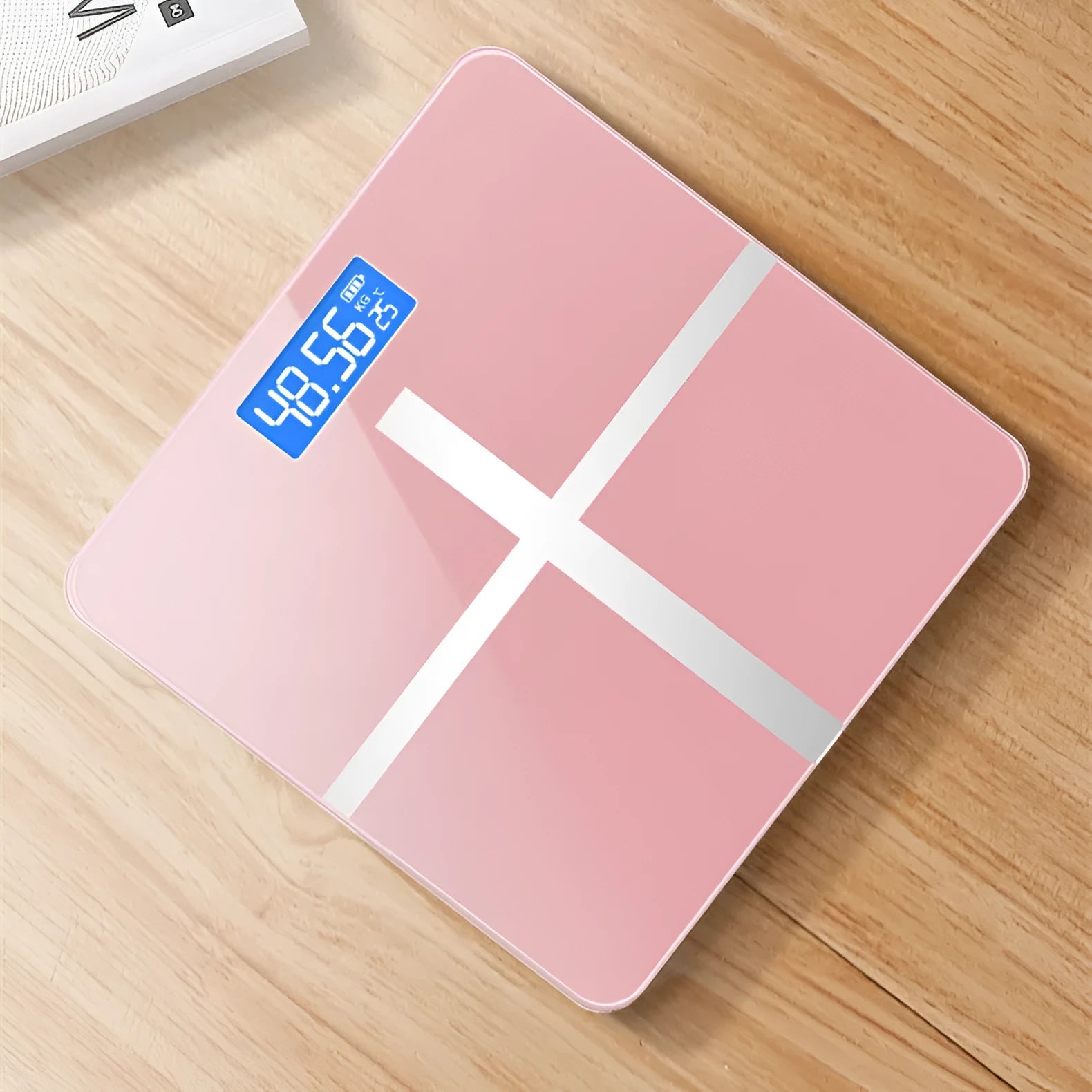 Electronic bathroom scales in cross pattern design with digital display