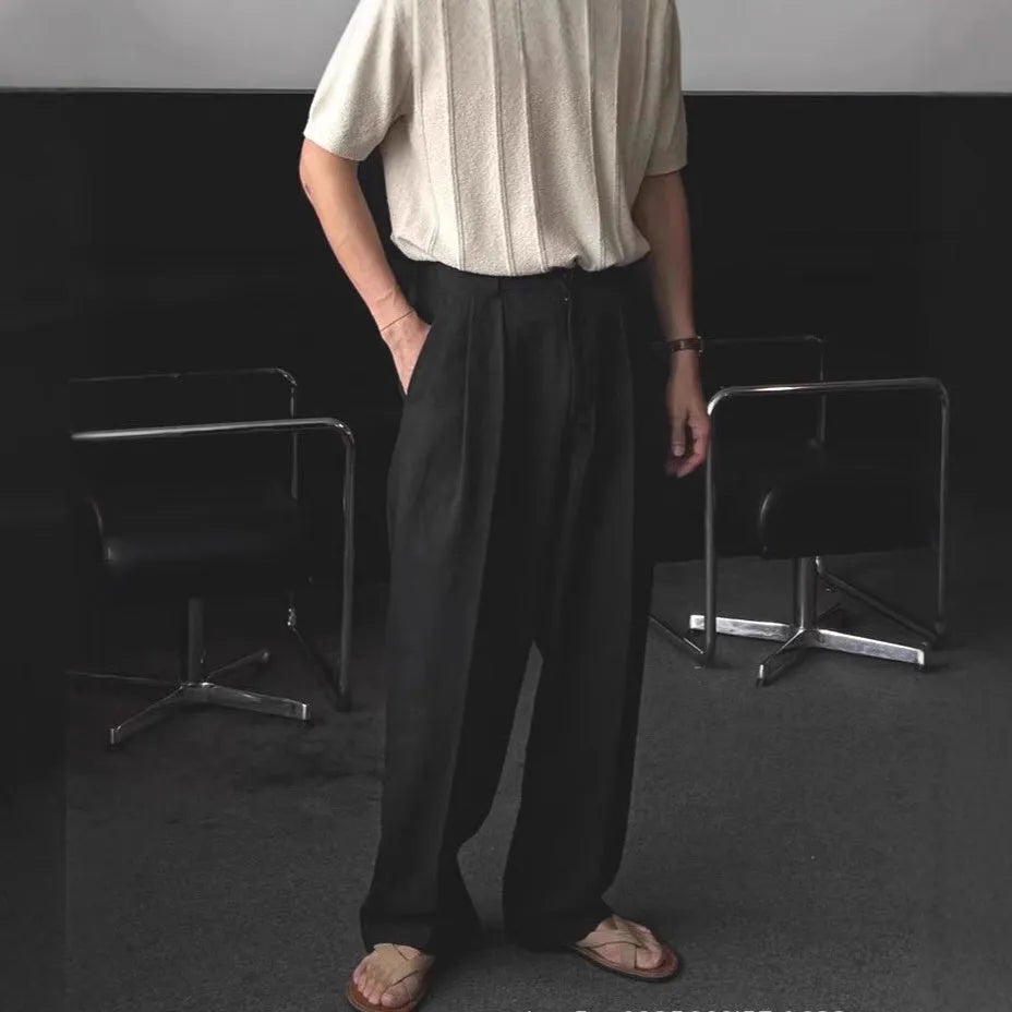 Men's apricot wide-leg cotton linen trousers with a loose fit and pencil leg opening.