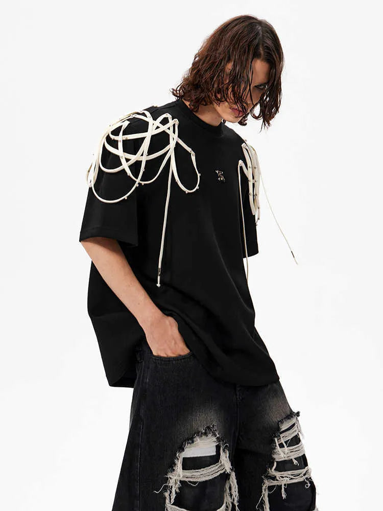 Black loose-fit short-sleeved T-shirt with ribbed padded shoulders on a hanger.