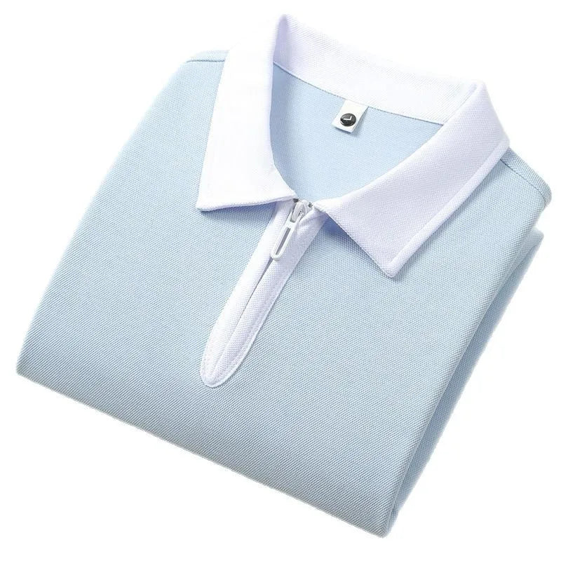 Short sleeve polo shirt with a zipper and lapel front in a solid colour, showing loose fit.