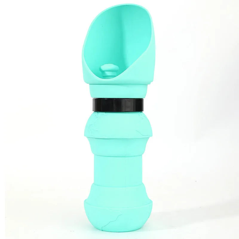 A pink silicone folding cup for pets, shown both expanded as a water bowl and collapsed flat for storage.