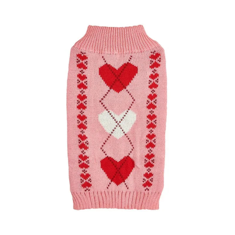 Red dog sweater with white love heart and bow design on a small dog