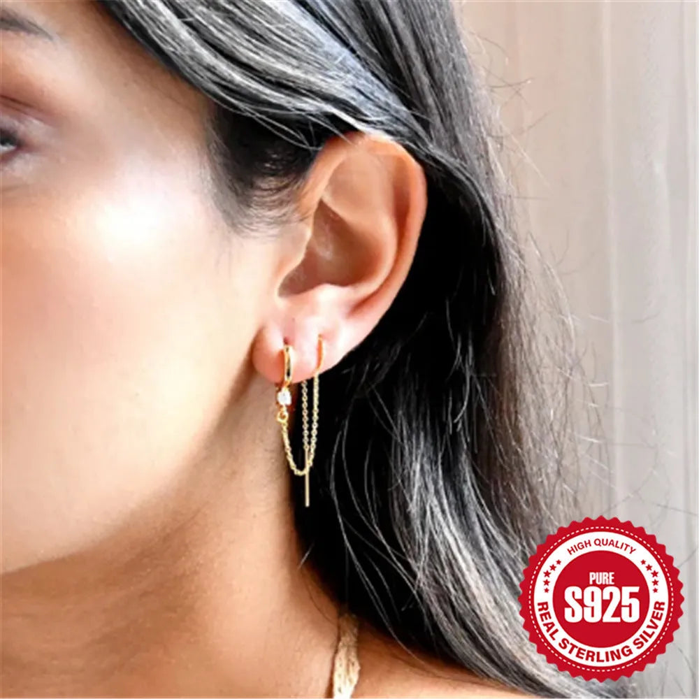 S925 sterling silver geometric earring with flower, tassel and chain detail in gold electroplated finish.
