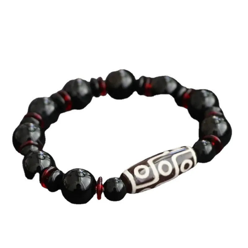 Black agate dzi bead bracelet with 11mm geometric beads and hand-woven construction