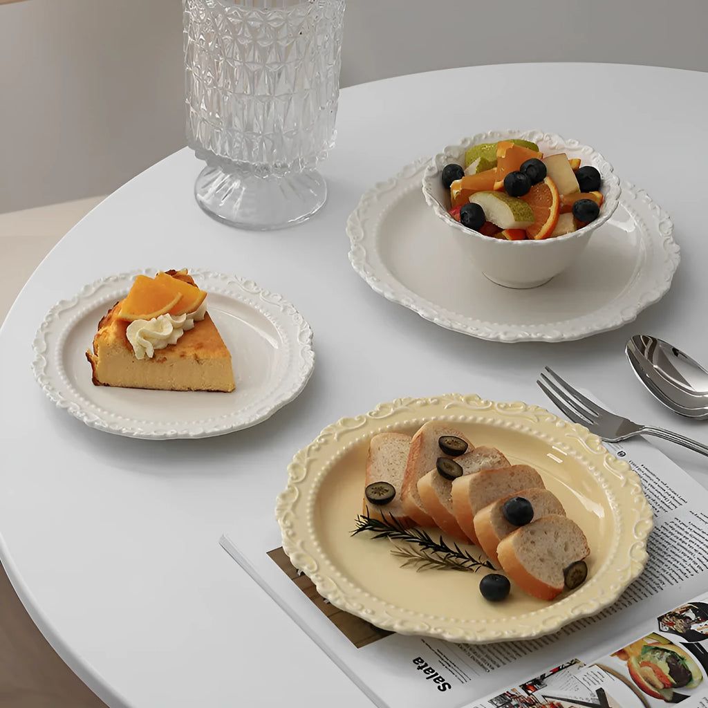 Cream ceramic lace vintage plate with irregular shape and coloured glaze, in white or yellow