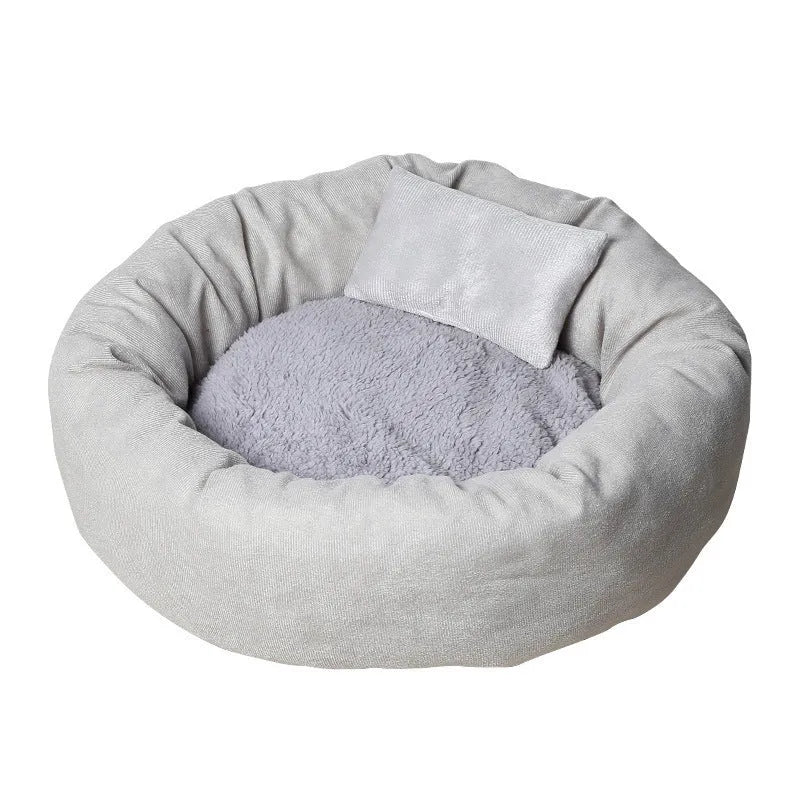 Soft light grey cotton-filled dog bed for a small dog, showing cloth material and round shape.