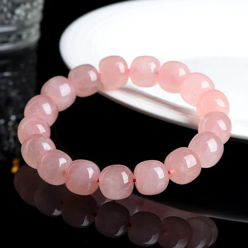 Natural crystal barrel bead bracelet with pink geometry beads measuring 8-10mm