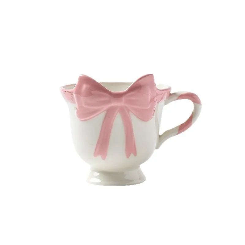Ceramic mug with girl heart bow design in black pink or white powder colours, 301-400ml capacity