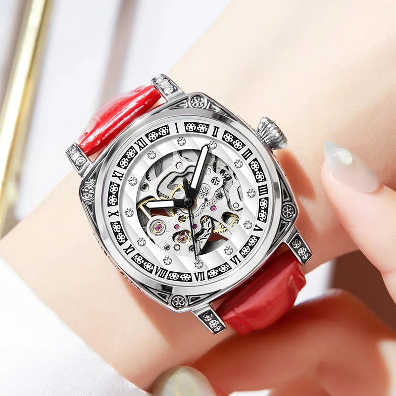Mechanical wristwatch with luminous dial on a leather strap, shown in multiple colour options.