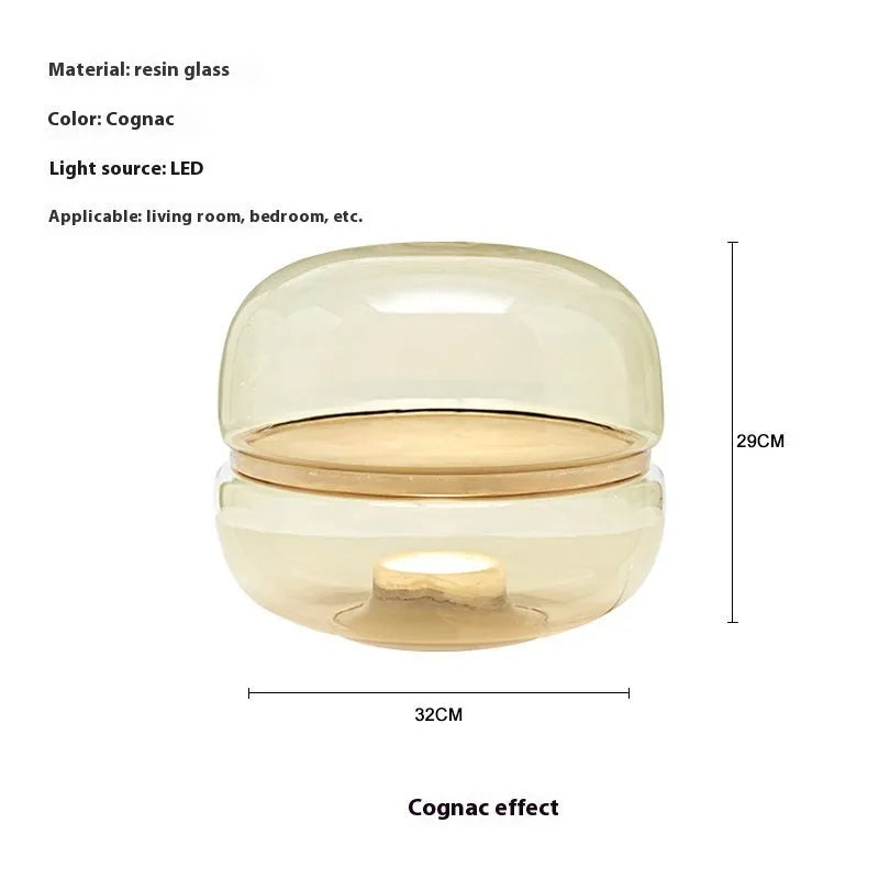 Nordic modern creative table lamp with warm light on a desk