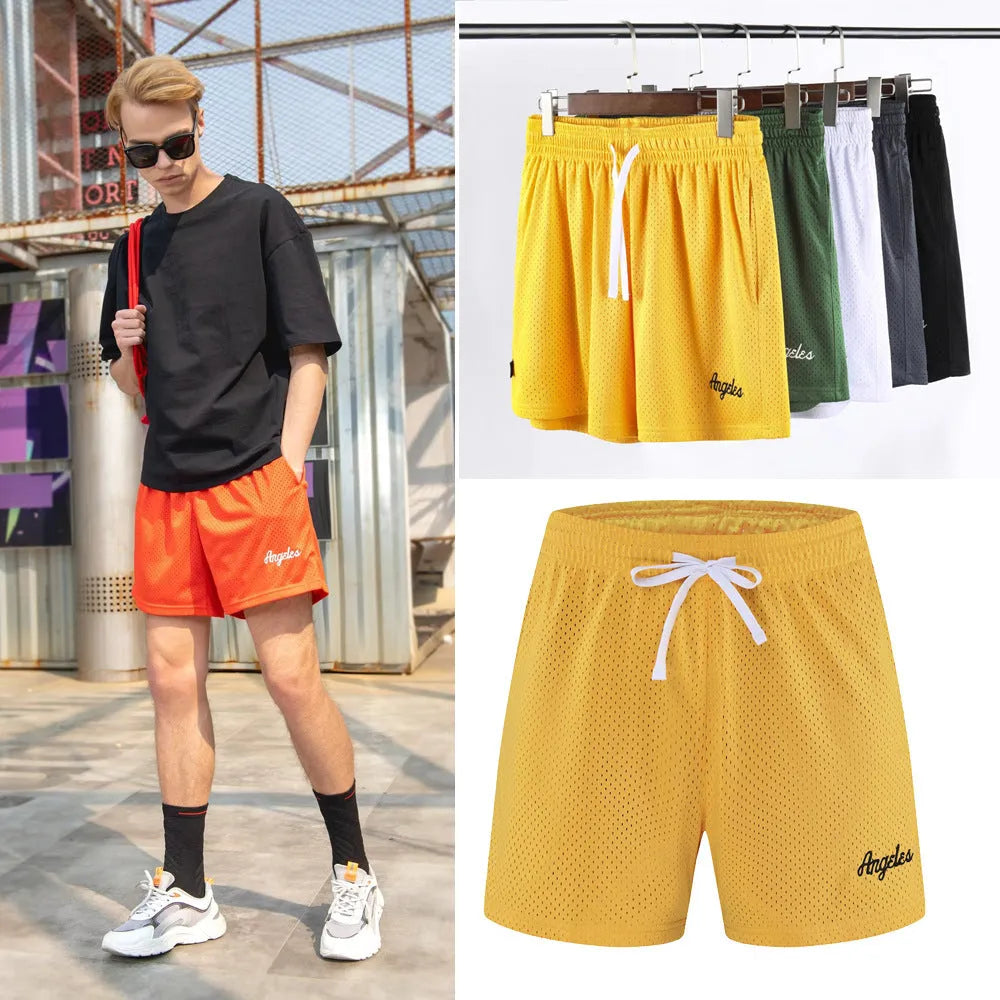 Men's black double-layer mesh sports shorts on a hanger with colour swatches showing white, yellow, green, and purple options.