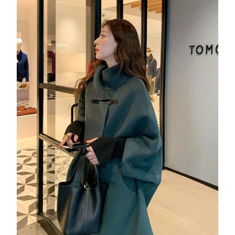Women's long acrylic coat in oatmeal colour with flight sleeves and 100cm length