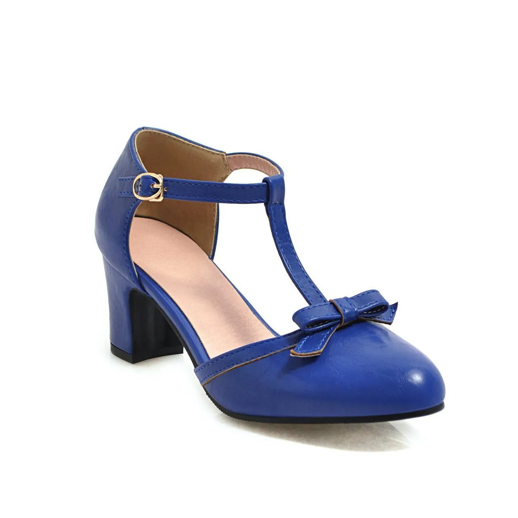 Yellow women's chunky heel sandals with a buckle strap and bow detail on a hollow-out round toe.