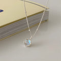 Round geometric 925 silver ornamental stone pendant on a silver curb chain necklace for women.