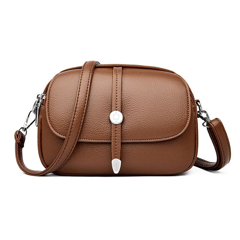 City Simple women's oval crossbody bag in soft PU leather available in black, khaki, or dark brown