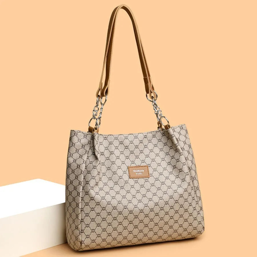 A brown retro-style women's PU leather handbag with a single strap and polyester lining.