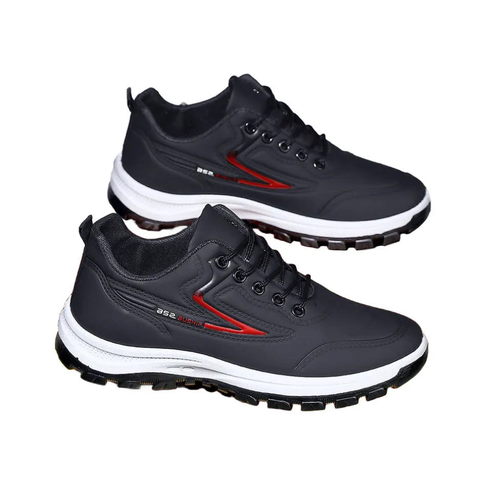 Black and grey low-top waterproof casual shoes with a lace-up front and plastic sole.