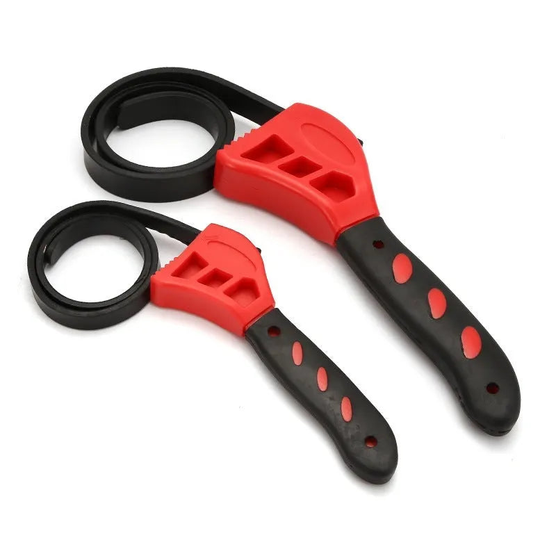 Two adjustable rubber strap wrenches, sizes 6-inch and 8-inch, with a 21.5 cm handle on a workbench.