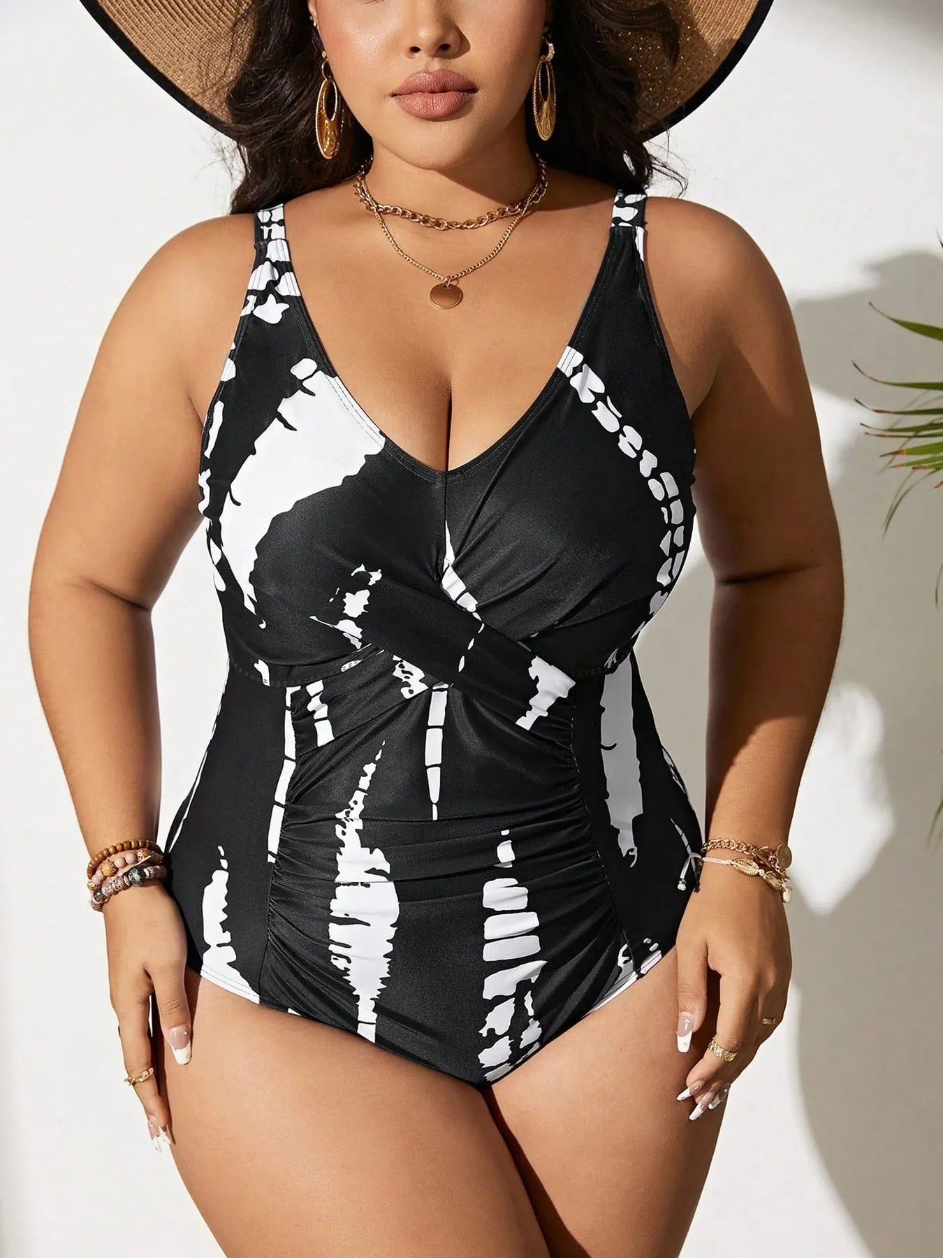 Black conservative one-piece swimsuit with sleeveless design and high-elasticity polyester construction