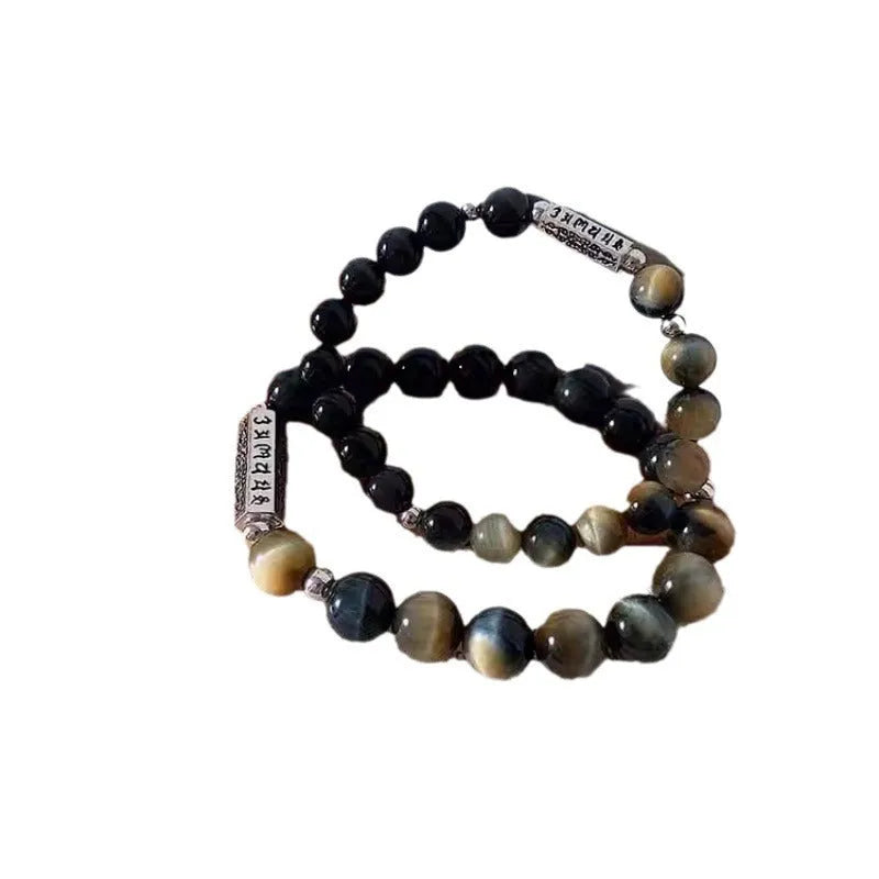 Sterling silver bracelet with obsidian and tigereye round beads featuring six words mantra Chinese design