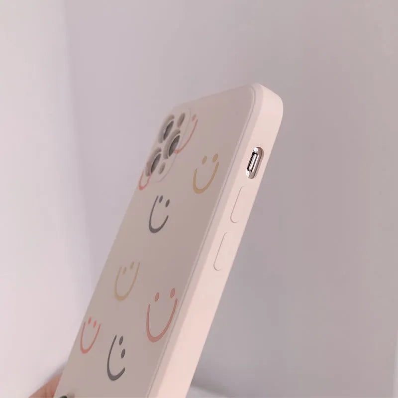 Silicone TPU phone case with painted smiley design for iPhone, shown in rainbow colour.