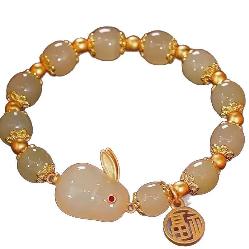 National style glass bracelet with rabbit charm and coloured glaze decoration