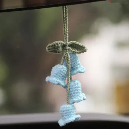 Green and white knitted wool plant ornament for car dashboard with hanging cord