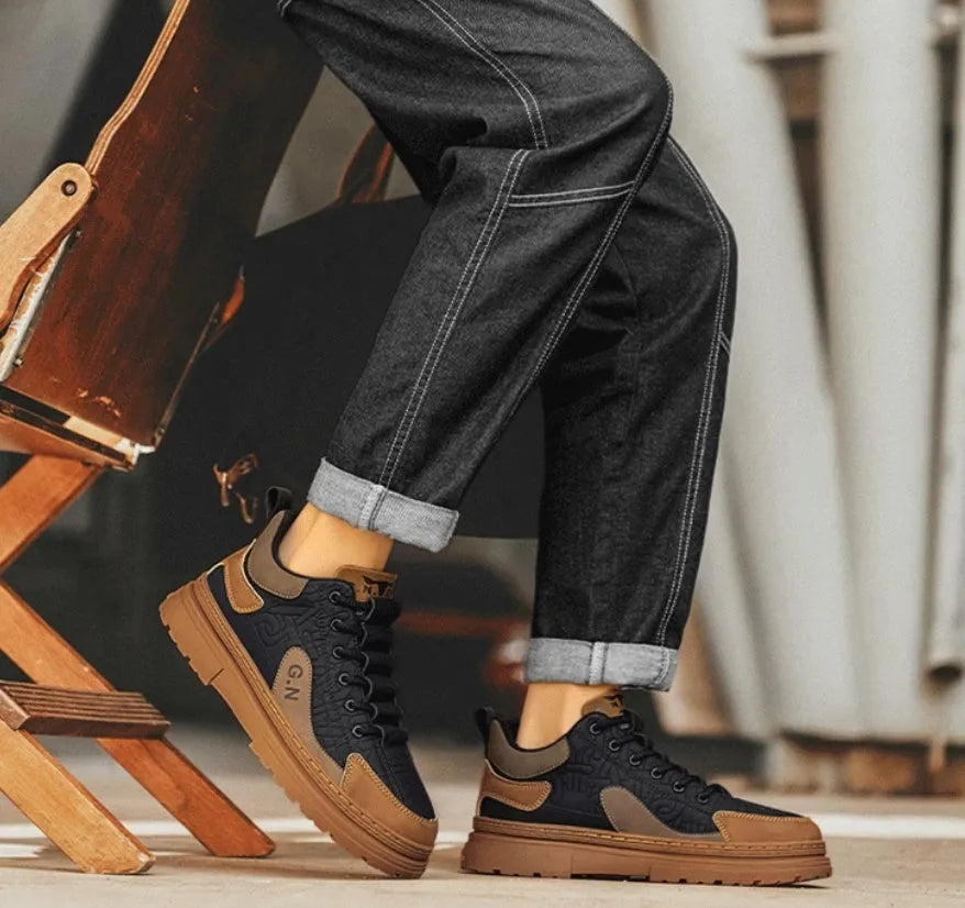 Black and white platform casual sneakers with thick rubber soles and colour-panelled pattern detailing