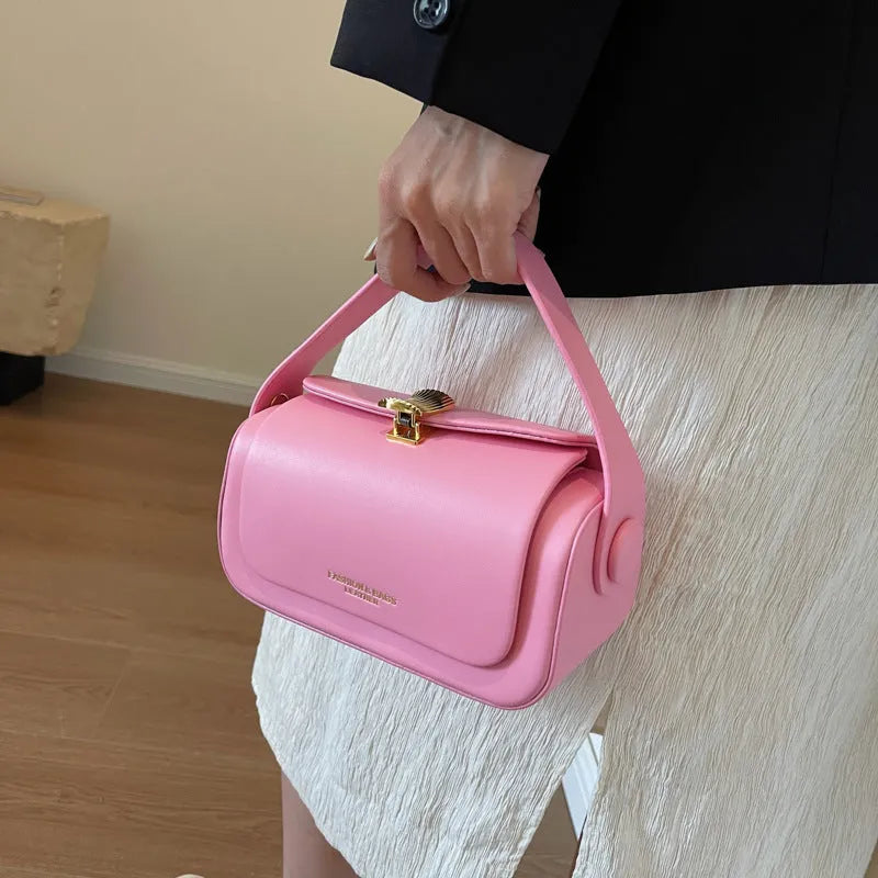 Women's personalised shoulder messenger bag in PU leather showing letter detailing and casual stitching