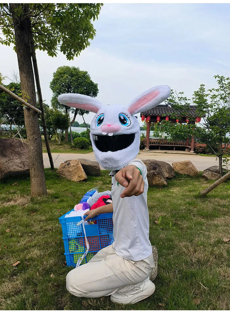 White rabbit plush helmet cover for electric motorcycle with long ears.