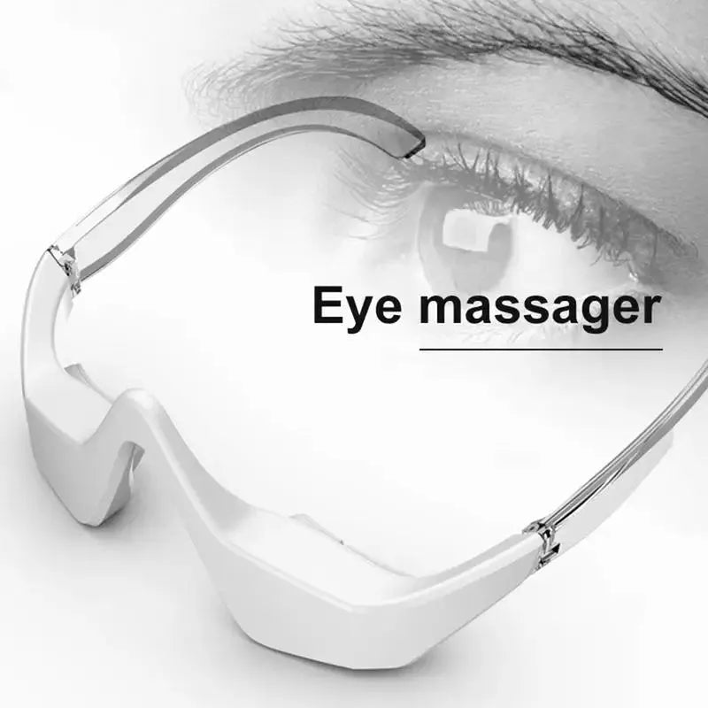 Pink and white 3D micro-current eye massager with glasses-style design on a stand.