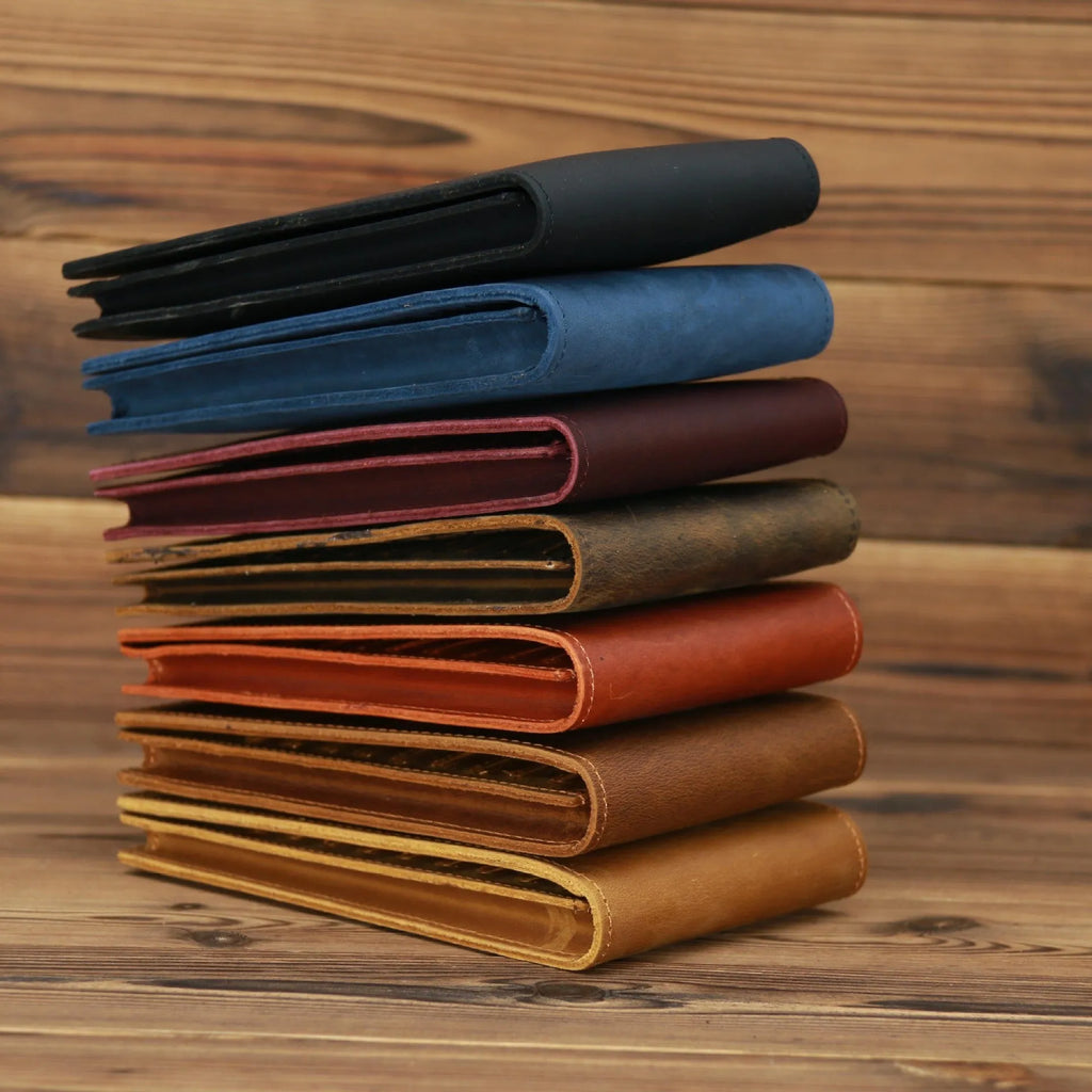 Slim black leather men's wallet open to show 18 card slots and a central mobile phone pocket.