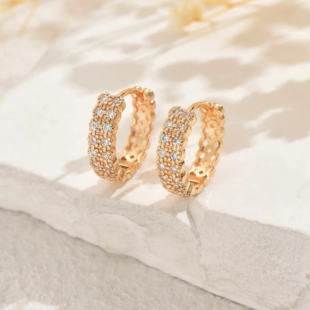 Copper geometry pattern ear studs with round, dot, and ring details in colour DE20288.