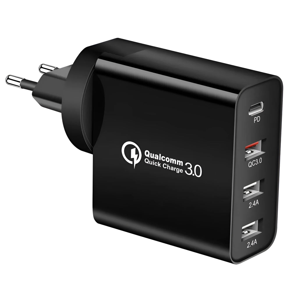 White multi-port fast charge wall charger with international plug options on a desk