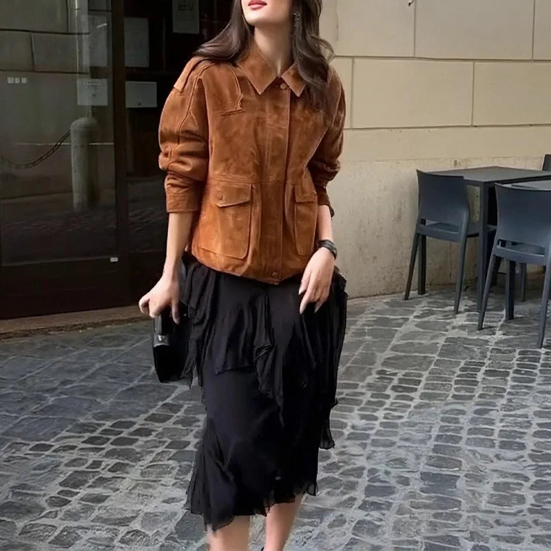 Women's brown suede coat with regular sleeves on a hanger.