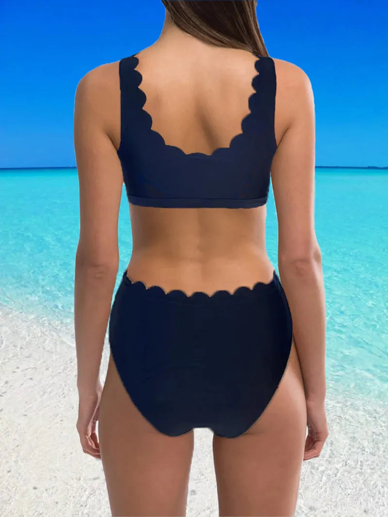 Women's solid colour polyester split swimsuit with gathering detail on a brief